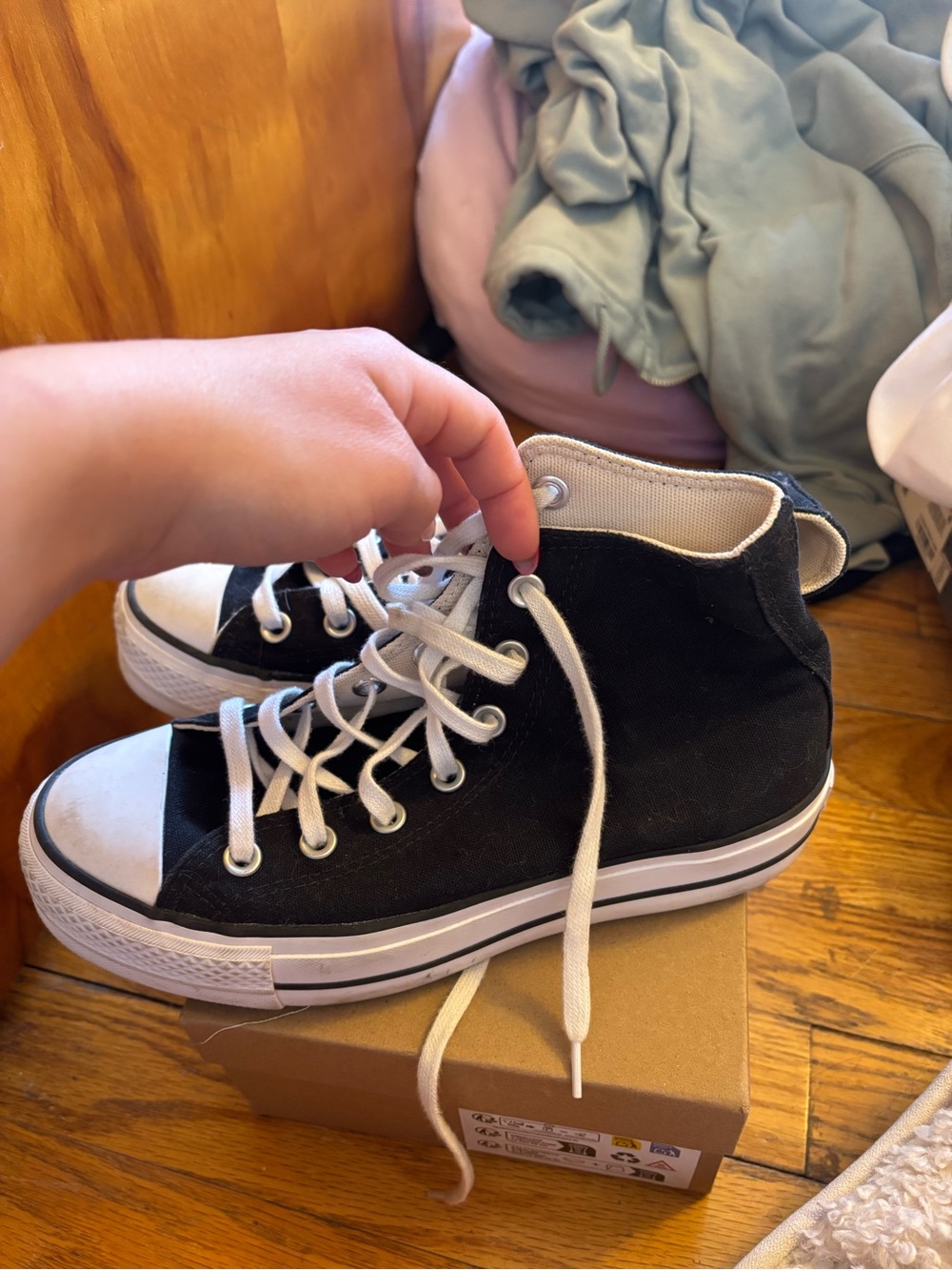 Black High-Top Converse Sneakers with White Laces